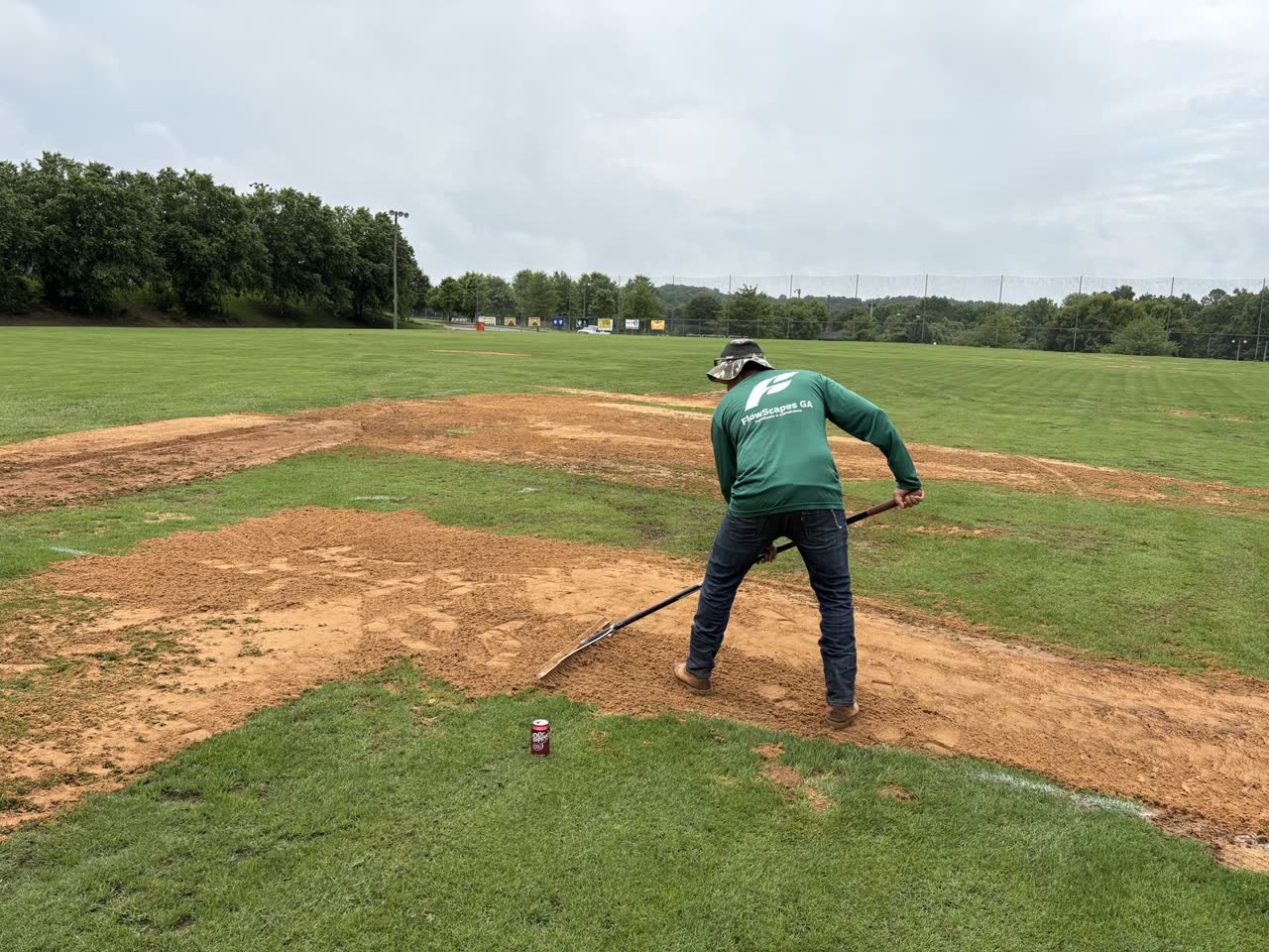 FlowScapes GA crew member grooming a local sports field